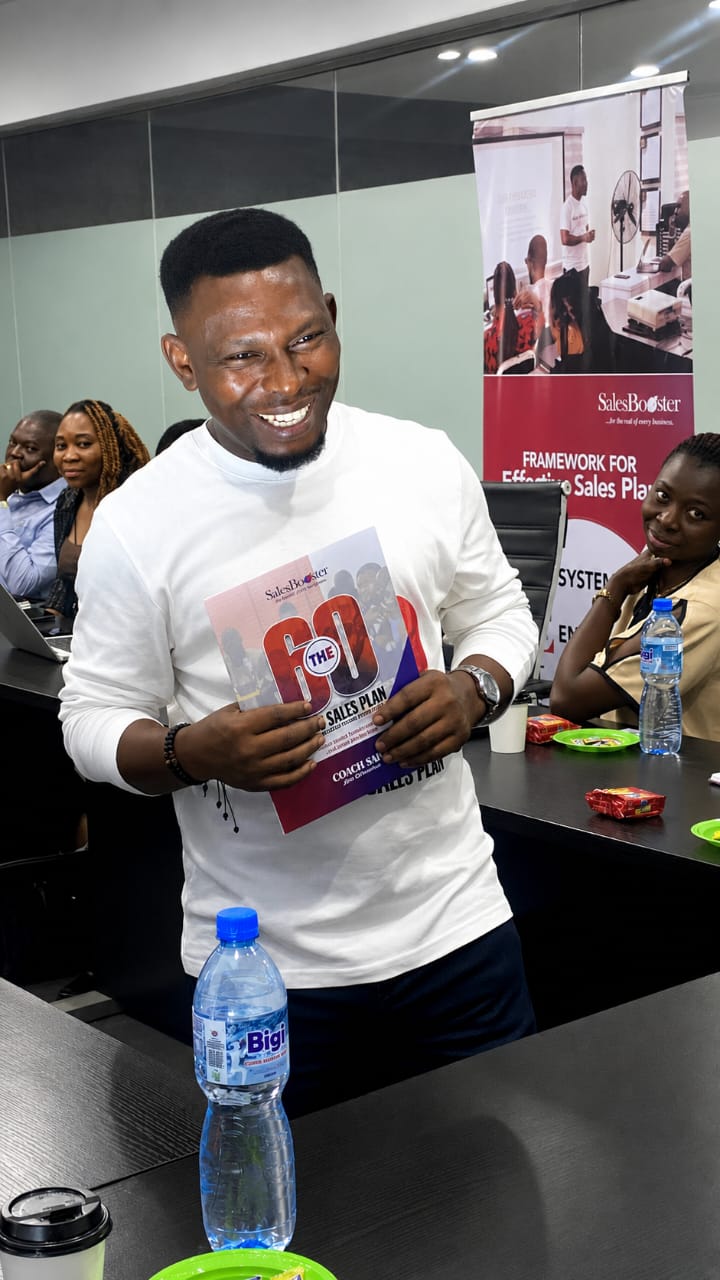 Coach Sam holding The 60-Day Sales Plan